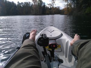 relaxing in hobie outback on a kayak fishing guide trip